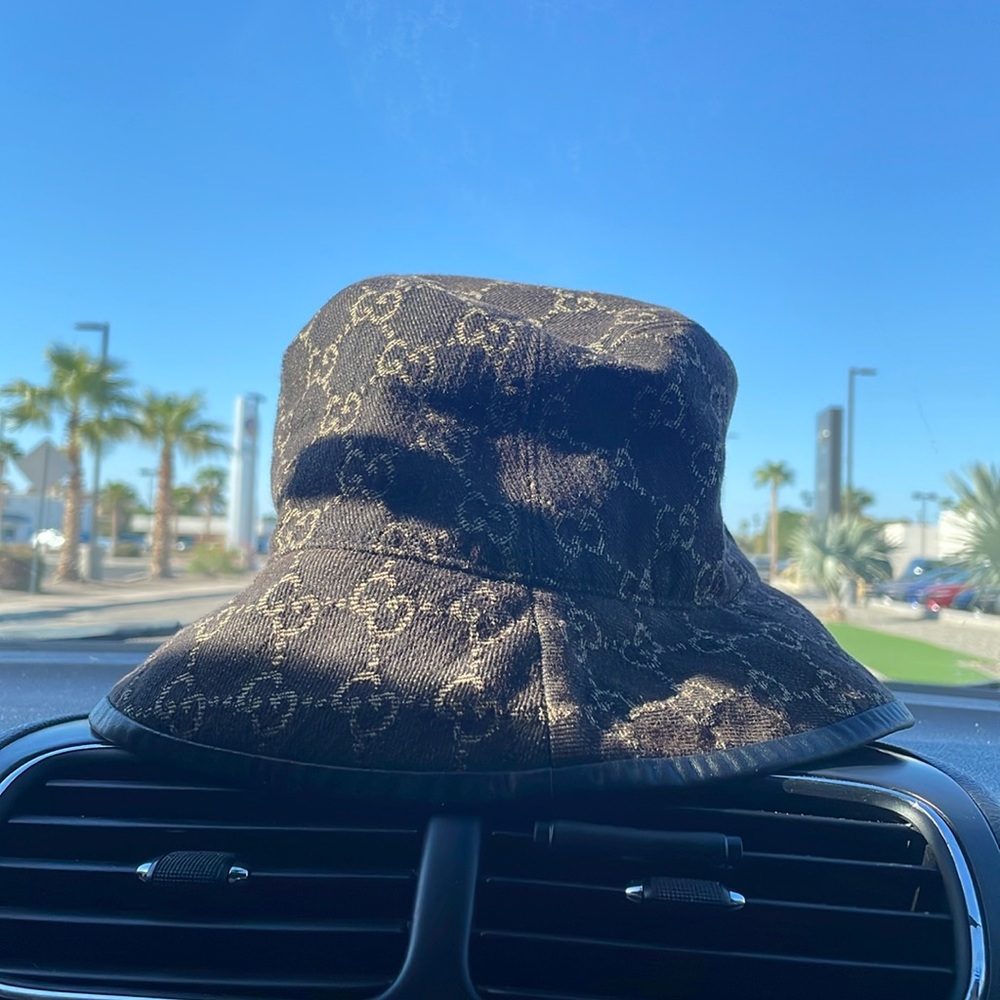Medium sized dark brown Gucci GG rip stop bucket hat